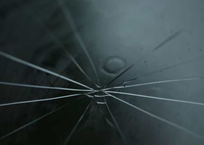 Windshield repair vs replacement in Cincinnati, OH Cracked windshield on a car in Cincinnati, OH that may need repair or replacement